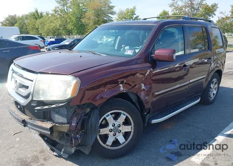 2011 Honda Pilot Touring z USA, uszkodzony, nr VIN 5FNYF4H94BB078832